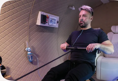 Athlete rowing inside the chamber